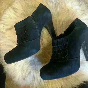Gianni Bini black suede booties with 4 inch heels. Worn 2 or 3 times.